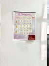 Printed Panchang calendar sheet with colorful date grid and red seal