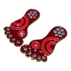 Decorative red rhinestone footprint toy with gold trim, featuring curved swirl designs