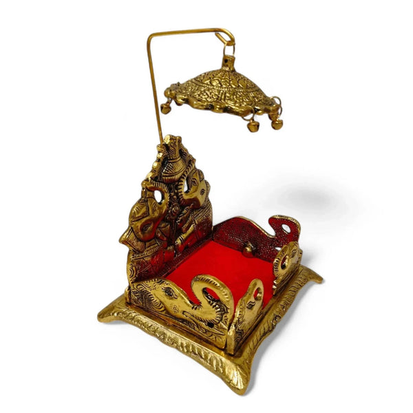 Decorative metal elephant singhasan with ornate base, red seat and gold finish