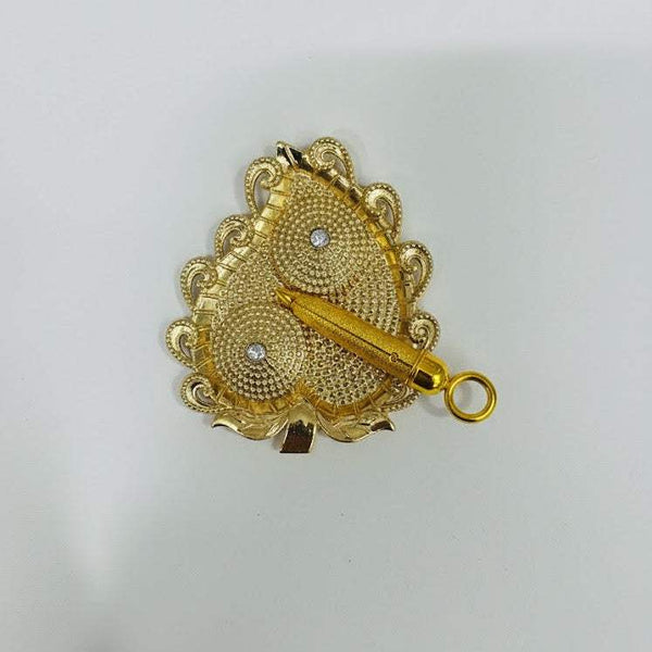 Ornate golden pichkari spray accessory with decorative flower-like design and ring handle