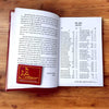 Maan Padhya Sangraha book open to two pages with printed text