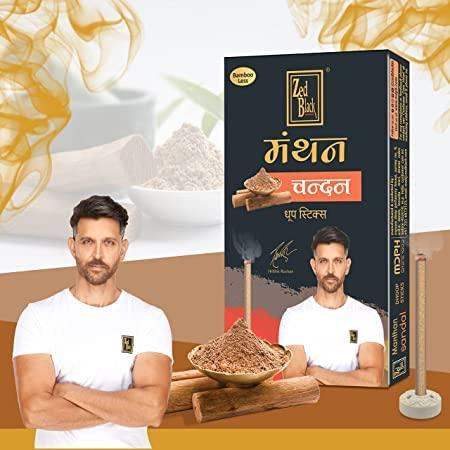 Incense stick pack with box, incense sticks, and scoop of dried incense powder