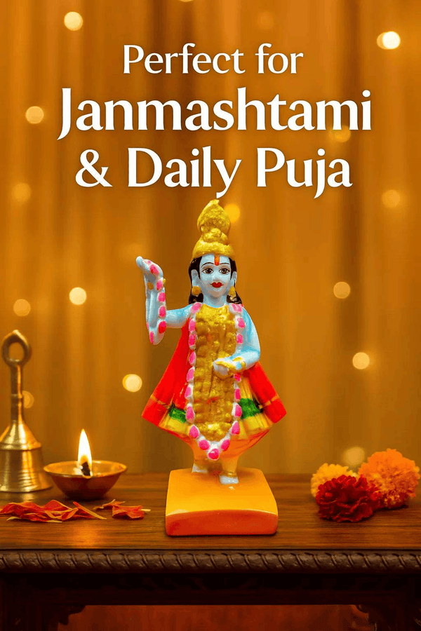 Standing blue goddess idol with gold crown, red dress and pink ornaments on square base
