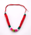 Red thread garland with green and pink pom-pom trim