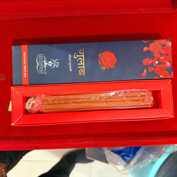 Open dhoop incense stick box showing brown sticks in inner packaging