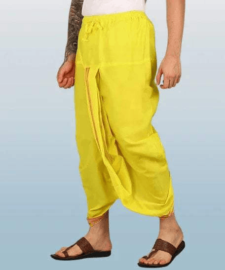 Pure cotton dhoti in bright yellow with thick embroidered border, loose pleated fit