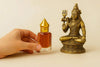 Kesar attar mini glass bottle with gold cap and amber liquid