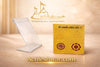 Golden yantra card beside clear acrylic stand with circular emblem and symbols