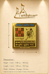 Square gold-plated yantra plaque with astrological symbols and central figure