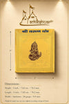 Gold yantra card shown on dimension chart with seated deity emblem